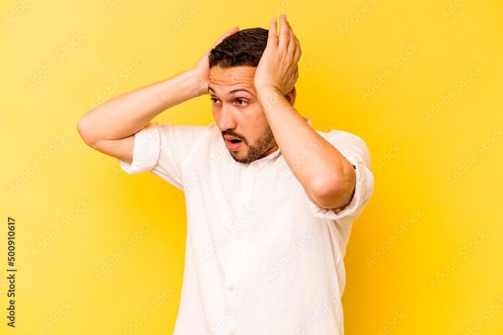 Young hispanic man isolated on yellow background screaming, very excited, passionate, satisfied with something. Young hispanic man isolated on yellow background screaming, very excited, passionate, satisfied with something.