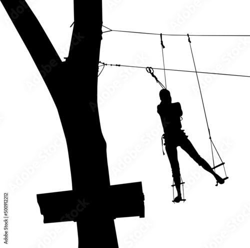 children in adventure park rope ladder.in adventure park rope ladder. Silhouette Adventure. Woman on cables in an adventure park on a difficult course	