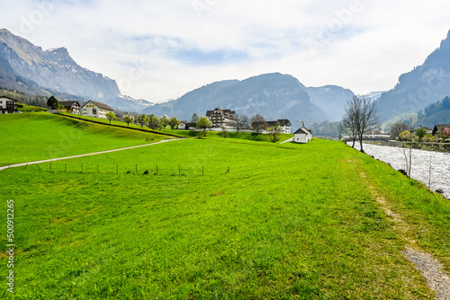 Muotathal, Dorf, Kloster, Wanderweg, Muota, Fluss, Muotatal, Bergtal, Pragelpass, Landwirtschaft, Felder, Frühling, Schwyz, Schweiz photo