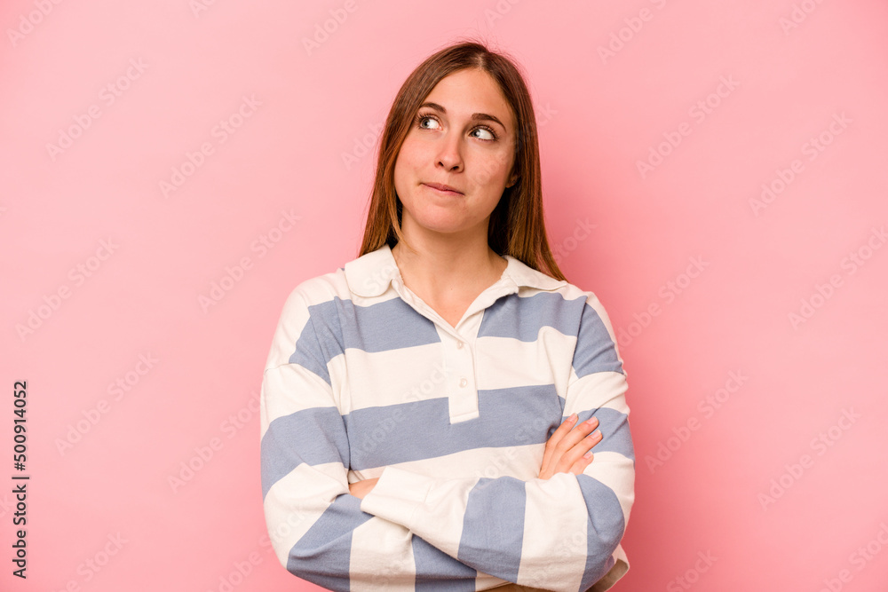 Young caucasian woman isolated on pink background dreaming of achieving goals and purposes Young caucasian woman isolated on pink background dreaming of achieving goals and purposes