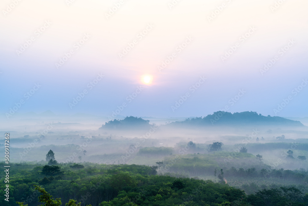 Obraz premium Morning sunrise above the landscape of rural area of Surat Thani province in Thailand