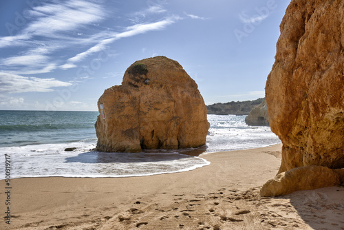 golden cliffs in the Praia do Vau beach in Portimao, Algarve, Portugal