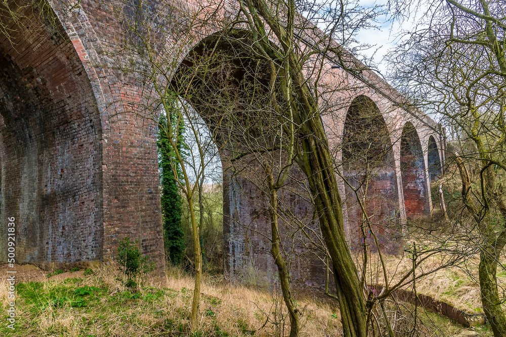 A view looking down the side of the abandoned Ingarsby Viaduct in Leicestershire, UK in early spring