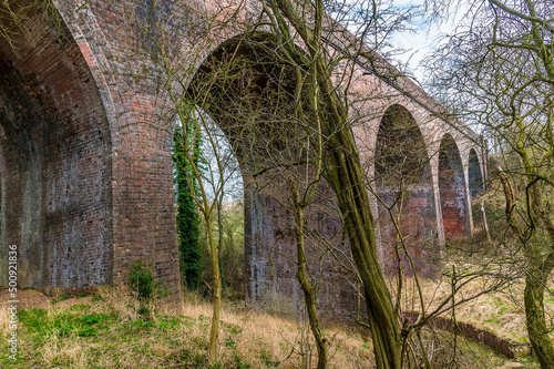 A view looking down the side of the abandoned Ingarsby Viaduct in Leicestershire, UK in early spring © Nicola