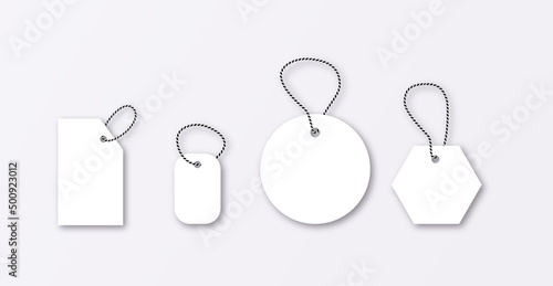 Set of luggage mockup tags isolated on a grey background with string threads, rectangular.