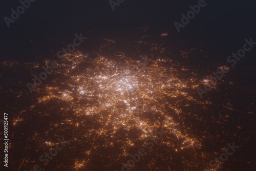 Aerial shot of Paris (France) at night, view from south. Imitation of satellite view on modern city with street lights and glow effect. 3d render