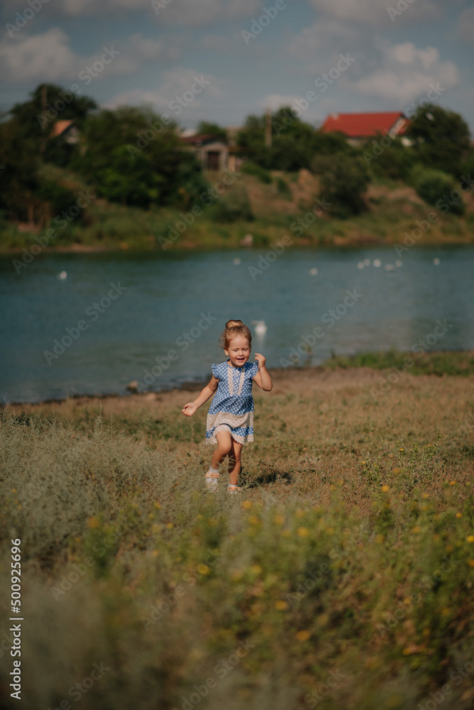 Mother and daughter playing on the lake