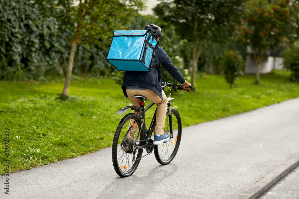 © Syda Productions - food shipping, transportation and people concept - delivery man in bike helmet with thermal insulated bag riding bicycle on city street © Syda Productions - food shipping, transportation and people concept - delivery man in bike helmet with thermal insulated bag riding bicycle on city street