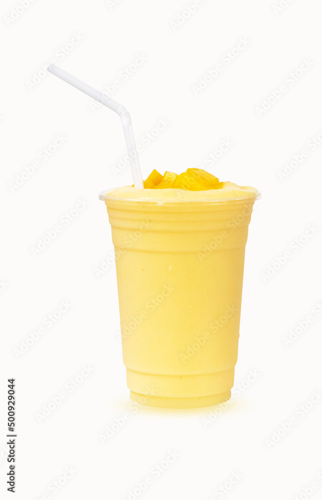 Foto Stock Fresh Mango ripe organic yellow smoothie honey mix with Straw in  plastic glass, Garnish isolated on white background. Ripe mangoes are  popular all over world. Perfect for summer drink. Healthy