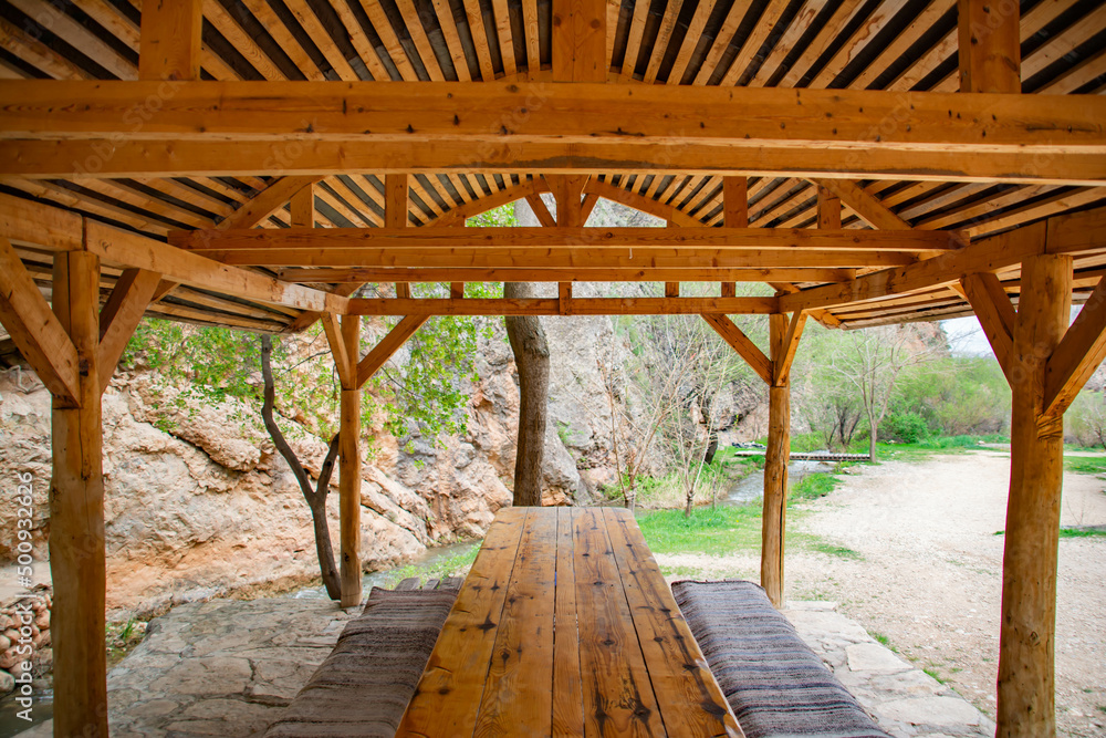 Wooden gazebo for a picnic in nature