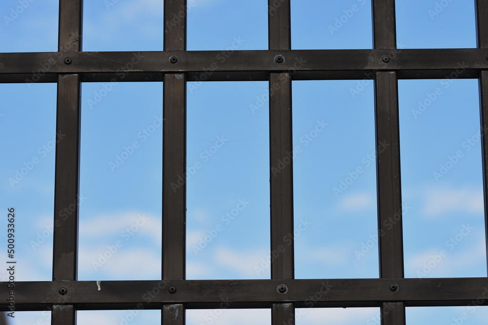 Fototapeta premium blue sky behind bars ,