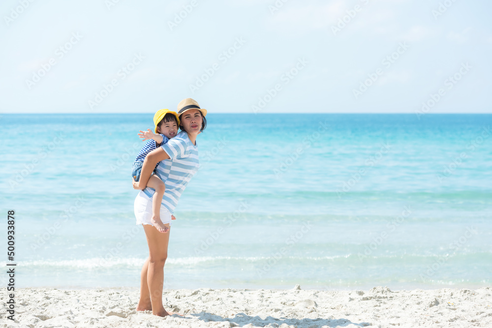 Happy family summer sea beach vacation. Asia young people lifestyle travel enjoy fun and relax leisure destination in holiday. Travel and Family Concept Happy family summer sea beach vacation. Asia young people lifestyle travel enjoy fun and relax leisure destination in holiday. Travel and Family Concept