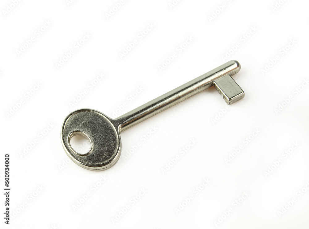 Single retro looking metallic door key isolated on white background Single retro looking metallic door key isolated on white background