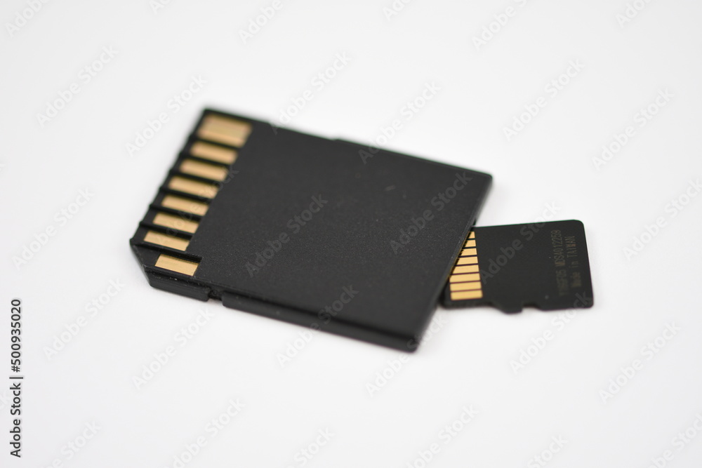 Black microSD memory card and SD card adapter isolated on white Black microSD memory card and SD card adapter isolated on white