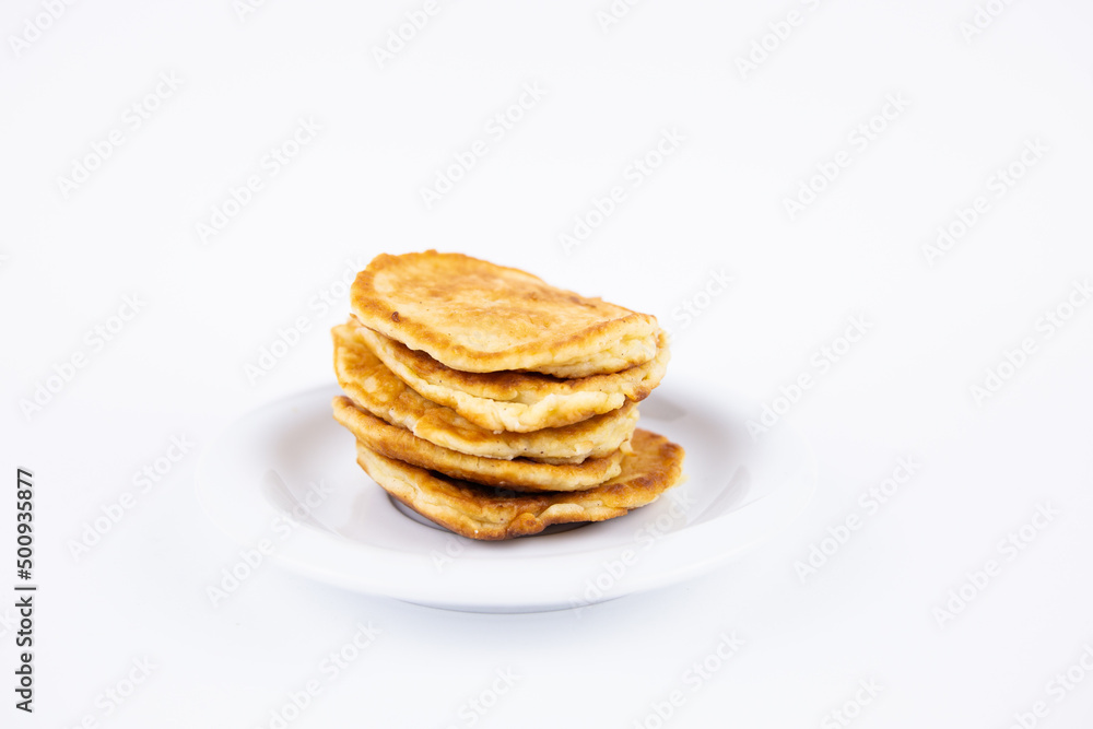 lush tasty fritters on a plate on a white background lush tasty fritters on a plate on a white background