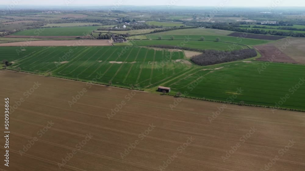 Low flight over trees and green newly planted fields. Springtime Low flight over trees and green newly planted fields. Springtime