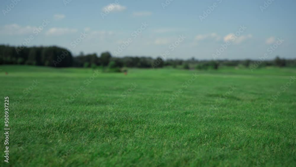 Golf course landscape view at country club. Grass fairway on summer sunny day. Golf course landscape view at country club. Grass fairway on summer sunny day.