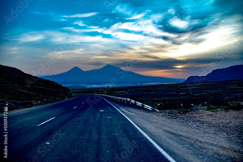 Road and beautiful Mount Ararat. Sunset over the mountain