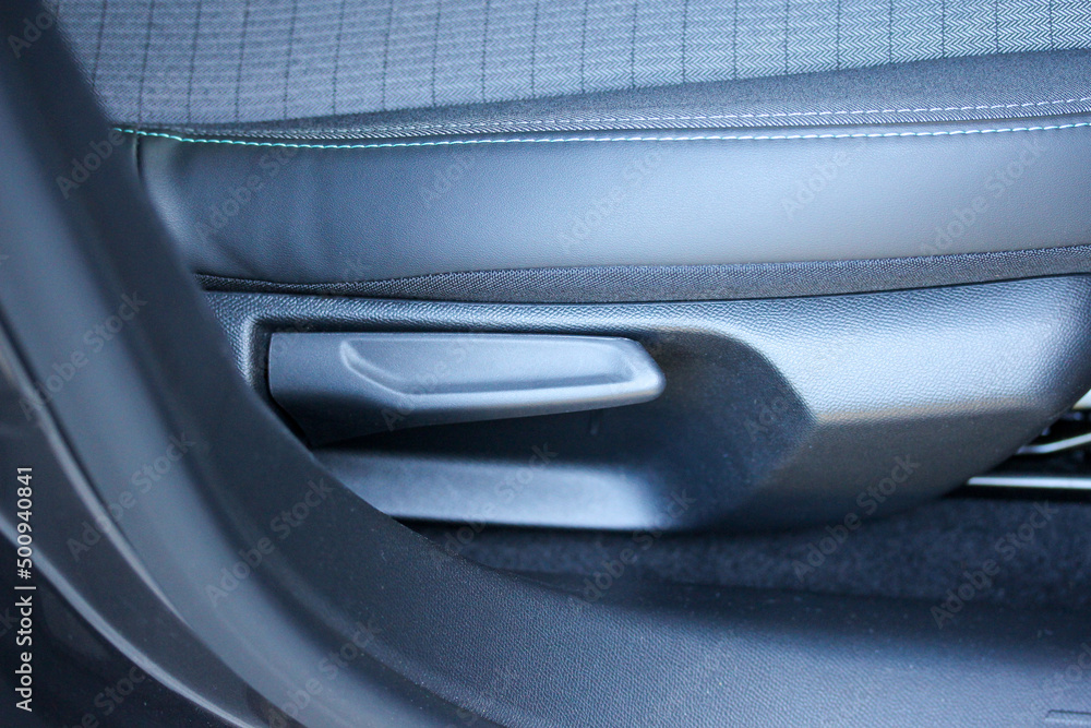 Manual seat adjustment lever in a new vehicle Stock Photo Adobe Stock