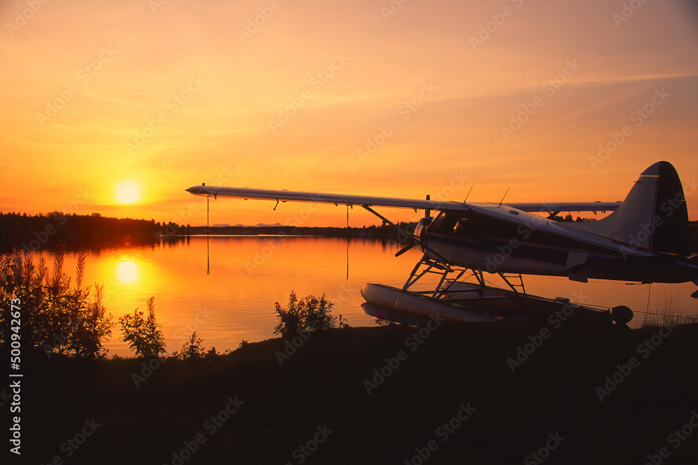 Float plane on Lake Hood at sunset, Anchorage, Alaska, USA Float plane on Lake Hood at sunset, Anchorage, Alaska, USA