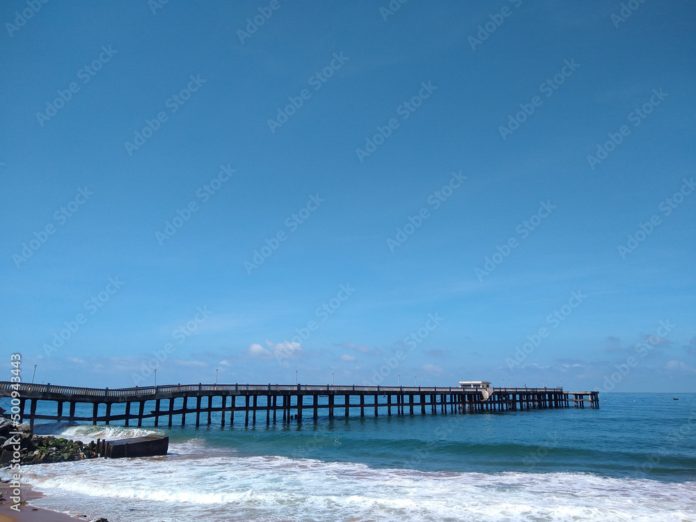 Valiyathura sea bridge, Thiruvananthapuram, Kerala, seascape view, blue sky background