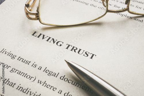 Fotografi Info about Living trust and glasses on it.