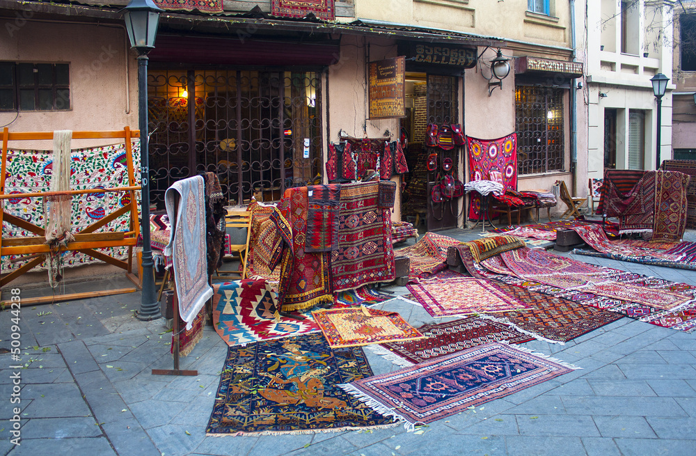 Old beautiful decorated carpets in the street market in Tbilisi Old town, Georgia