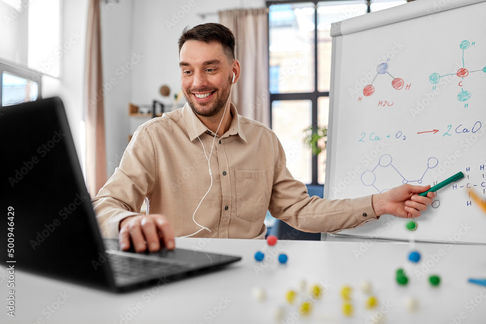 distance education, school and remote job concept - happy smiling male chemistry teacher with 