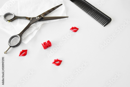 Hairdressing various accessories on a light background. beauty hairdressing industry concept. hairdressing scissors and comb