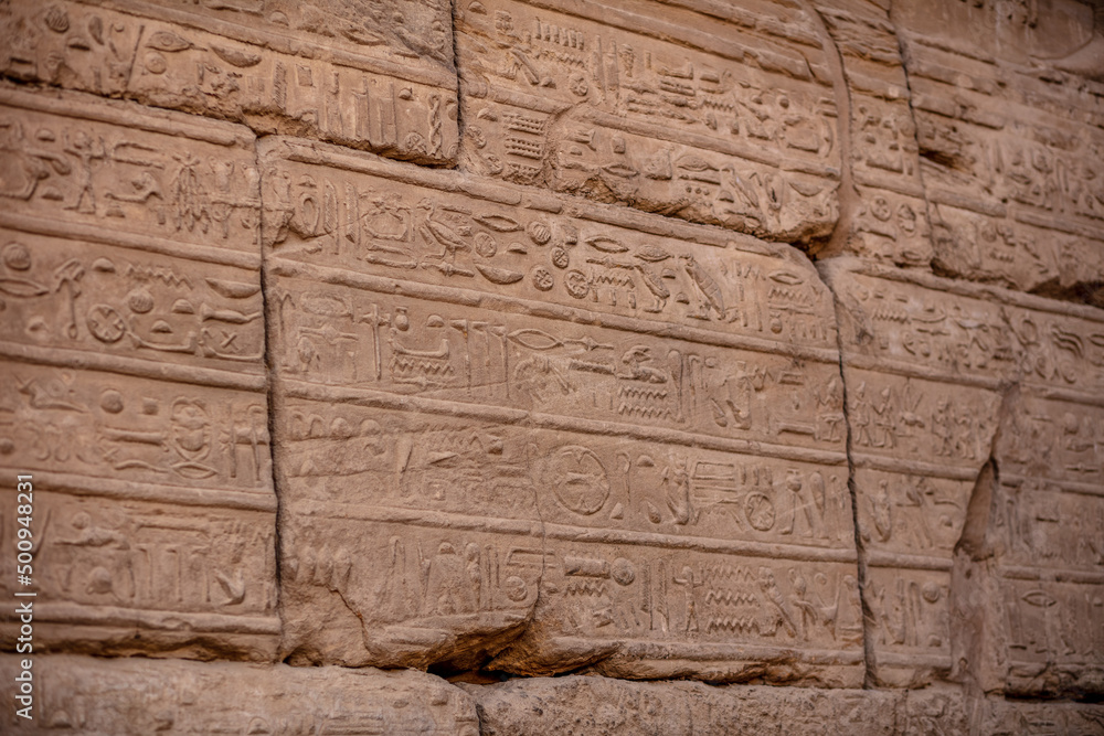 Different hieroglyphs on the walls and columns in the Karnak temple. Karnak temple is the largest complex in ancient Egypt. Different hieroglyphs on the walls and columns in the Karnak temple. Karnak temple is the largest complex in ancient Egypt.