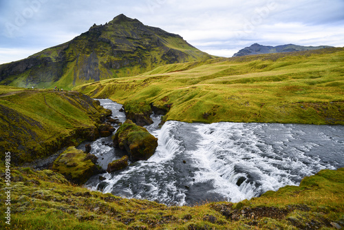 A river cascading through the beautiful volcanic landscape on the trek from Skógafoss up to the Fimmvörðuháls hut and pass, south Iceland photo