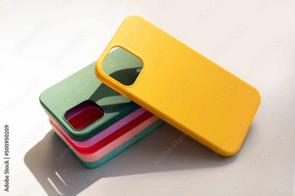 Cases set for smartphone on grey background. Silicone protection for mobile phone. Colorful silicone phone cases. Cases set for smartphone on grey background. Silicone protection for mobile phone. Colorful silicone phone cases.