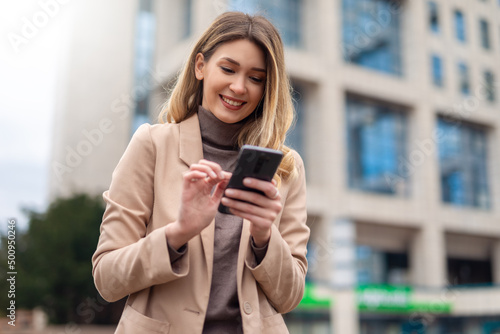 Business woman using phone to send message