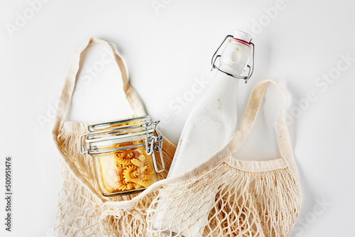 Zero waste, plastic-free and eco-friendly lifestyle. Cotton mesh bag, glass bottle and jar for package free shopping