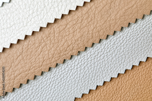 close up leather fabric catalog for interior uphostery works in light grey ,brown and beige tone color photo