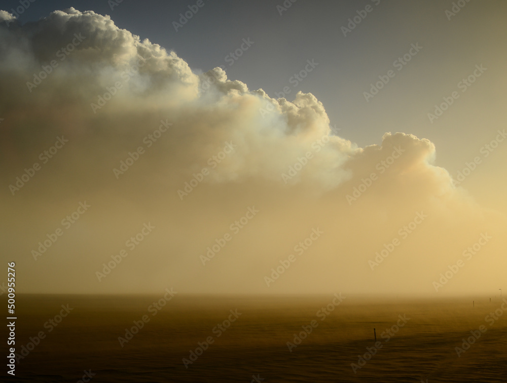 The smoke column of the 2014 Bardarbunga eruption at the Holuhraun volcanic fissures at sunset during a sandstorm in the otherworldy desert landscape of the Central Highlands, Iceland