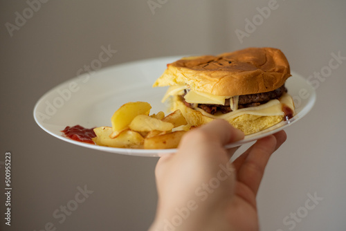Handmade hamburger with french fries and dips made at home