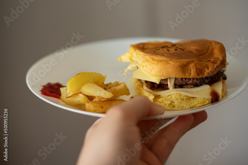 Handmade hamburger with french fries and dips made at home