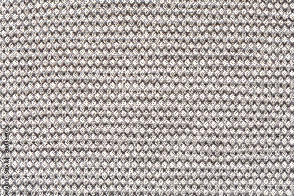 Knitted texture. Texture of jacquard fabric with gray geometric pattern. Crochet mosaic pattern