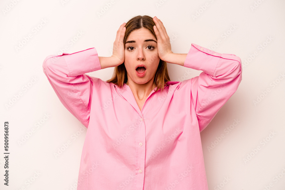 Young caucasian woman isolated on white background being shocked, she has remembered important meeting. Young caucasian woman isolated on white background being shocked, she has remembered important meeting.
