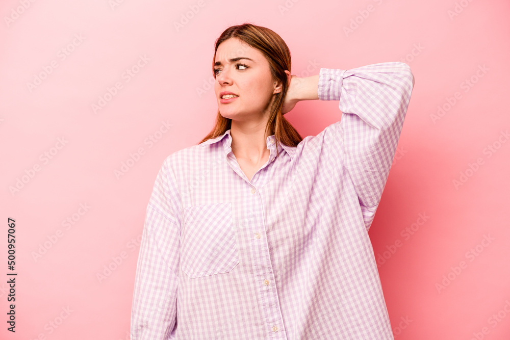 Young caucasian woman isolated on pink background tired and very sleepy keeping hand on head. Young caucasian woman isolated on pink background tired and very sleepy keeping hand on head.