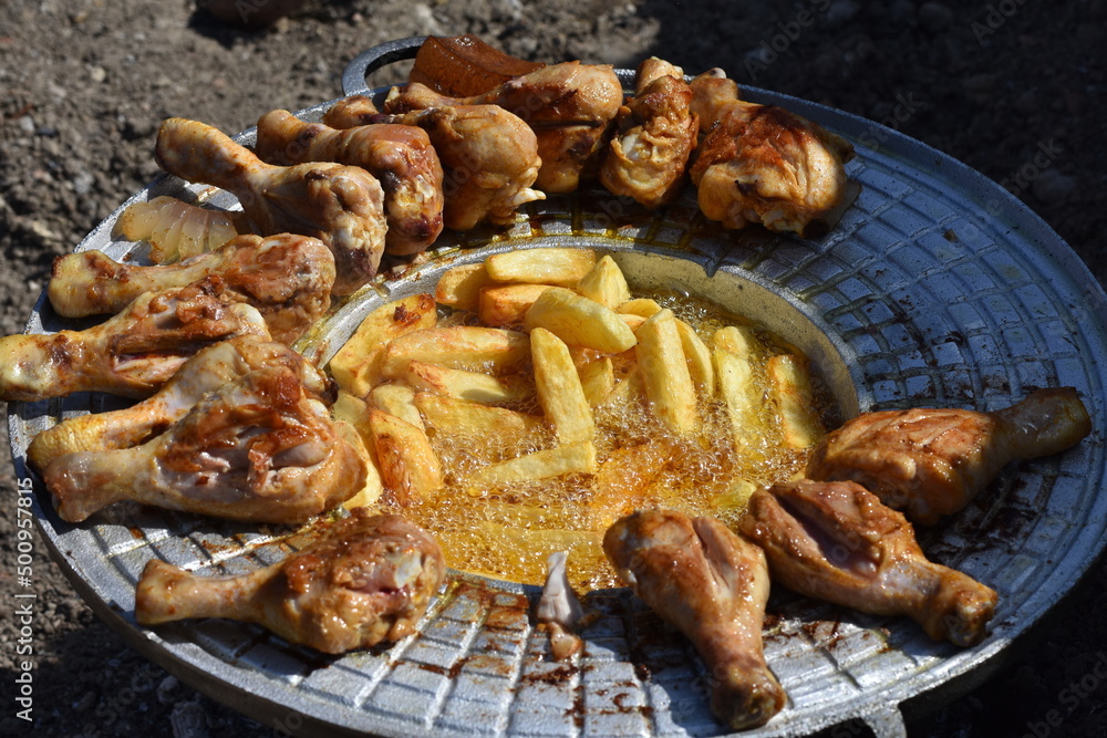 crispy chicken and fried potatoes crispy chicken and fried potatoes