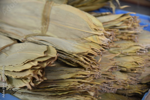 Dried Ruo leaves used to wrap rice dumpling on dragon boat festival. Traditional Chinese food natural wrapping materials. photo