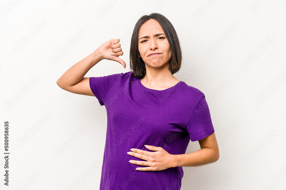 Young hispanic pregnant woman isolated on white background feels proud and self confident, example to follow. Young hispanic pregnant woman isolated on white background feels proud and self confident, example to follow.