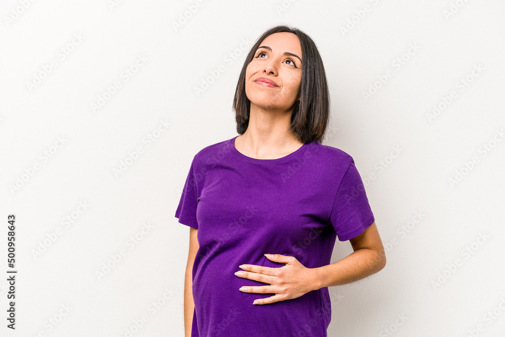 Young hispanic pregnant woman isolated on white background dreaming of achieving goals and purposes Young hispanic pregnant woman isolated on white background dreaming of achieving goals and purposes
