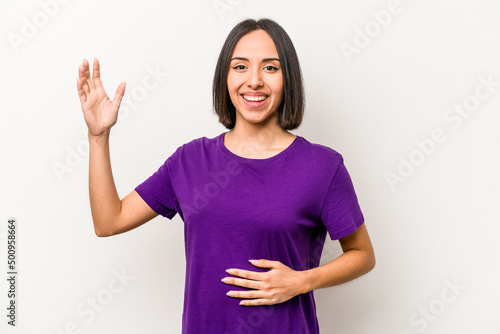 Wallpaper Mural Young hispanic pregnant woman isolated on white background receiving a pleasant surprise, excited and raising hands. Torontodigital.ca