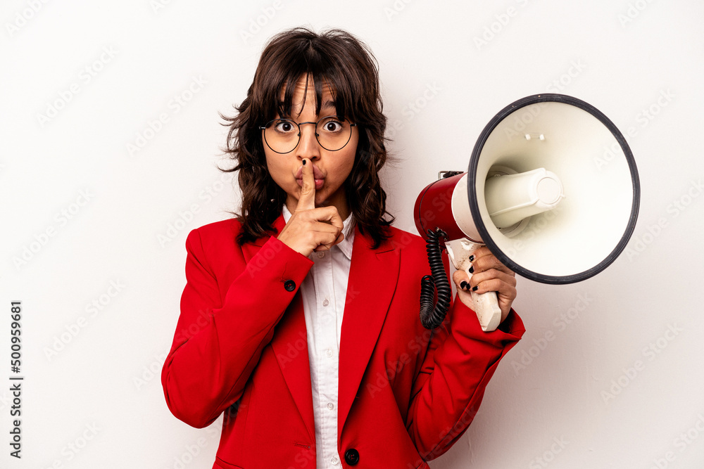 Young business hispanic woman holding an megaphone isolated on white background keeping a secret or asking for silence.