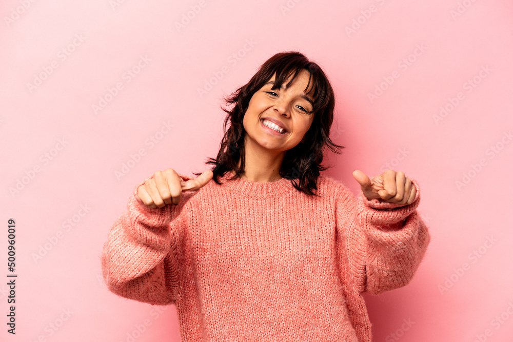 Young hispanic woman isolated on pink background raising both thumbs up, smiling and confident. Young hispanic woman isolated on pink background raising both thumbs up, smiling and confident.