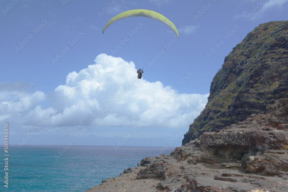 Paraglider Hovering Over Makapu'u Point On The East Coast Of Oahu Island Hawaii Paraglider Hovering Over Makapu'u Point On The East Coast Of Oahu Island Hawaii