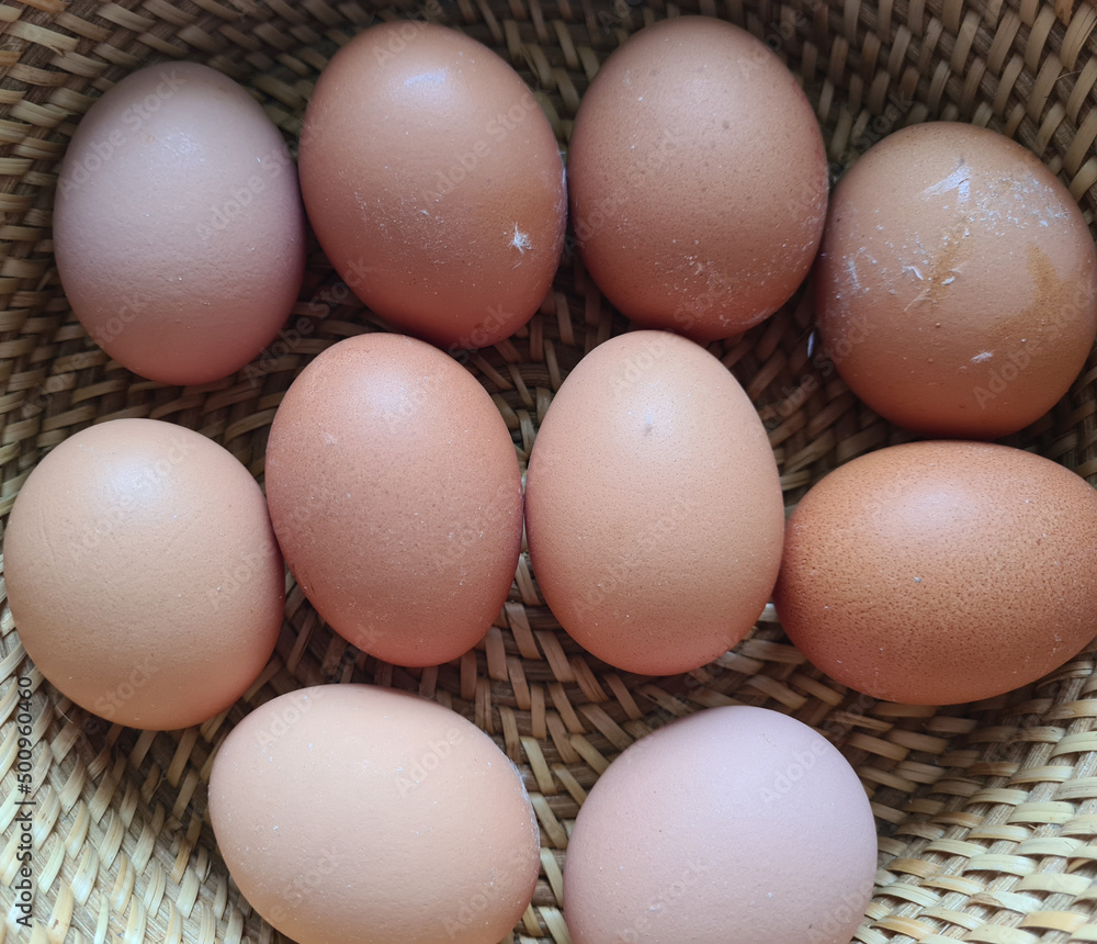 Chicken eggs in basket. Easter dinner with chicken eggs in brown baskets. Chicken eggs in basket. Easter dinner with chicken eggs in brown baskets.
